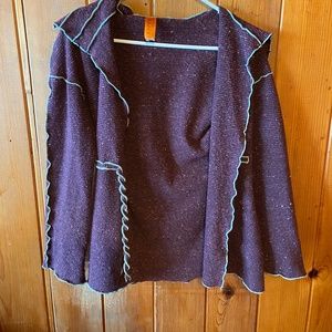 Funky purple and teal sweater.